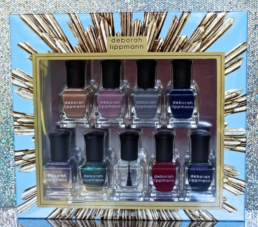 The Deborah Lippmann LE Gel Lab Pro Color gift set including the Hard Rock Base/Top Coat from Left to Right:GEL LAB PRO Color formula set includes: Emperor's New Clothes (nude crème) Ever After (rosy mauve crème) King Of The Road (medium grey creme) Blue Blood (royal blue crème) Crown Velvet (royal purple crème) If I Ruled The World (forest green shimmer) Hard Rock (nail strengthening base and top coat) Reign Of Love (rich red crème) Queen Of The Night (blackened purple shimmer).