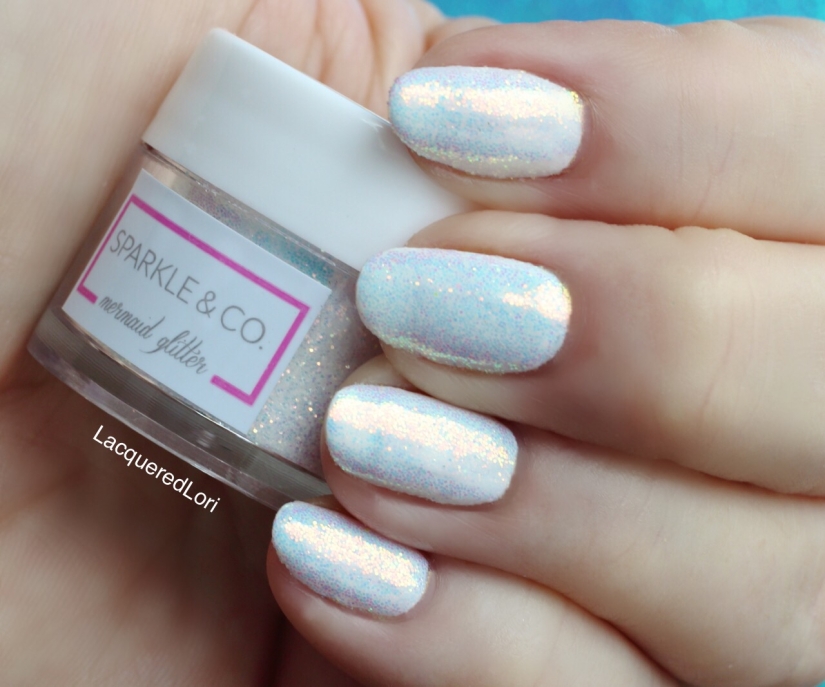 Sparkle & Co G.31 Fairy Dust over white gel by the same company #002.